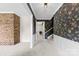 The entryway features wallpaper, brick accents, carpet, and a staircase leading to the upper level at 111 Kelly Ln, Gastonia, NC 28056