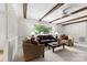 Inviting living room with beamed ceilings, a large window, and cozy seating arrangement at 111 Kelly Ln, Gastonia, NC 28056