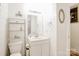 Bright bathroom featuring a vanity, tiled floors, and ample storage at 1116 Crestview Dr, Salisbury, NC 28146