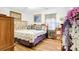 Cozy bedroom featuring hardwood floors, comfortable bed, and decorative artwork creating a peaceful retreat at 1116 Crestview Dr, Salisbury, NC 28146
