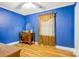 Vibrant bedroom with hardwood floors, vintage dresser, natural light and unique design at 1116 Crestview Dr, Salisbury, NC 28146