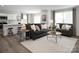 Inviting living area featuring a modern kitchen island, comfortable seating, stylish decor, and abundant natural light at 1202 Elm Forest Ln, China Grove, NC 28023