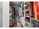 Organized walk-in closet with custom shelving, drawers and hanging storage at 122 Ringneck Trl, Mooresville, NC 28117