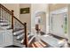 Elegant foyer with hardwood floors, staircase with iron spindles, and a view into adjacent rooms at 122 Ringneck Trl, Mooresville, NC 28117