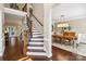 Spacious foyer featuring hardwood floors, stairs with wrought iron, and a dining room at 122 Ringneck Trl, Mooresville, NC 28117
