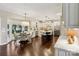 Bright, open kitchen with white cabinets, a central island, stainless steel appliances, and a breakfast nook at 122 Ringneck Trl, Mooresville, NC 28117
