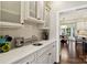 Kitchen with a beverage center, white cabinets, granite countertops, and stainless steel appliances at 122 Ringneck Trl, Mooresville, NC 28117