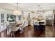 Spacious kitchen featuring white cabinetry, a central island, stainless steel appliances, and a breakfast nook at 122 Ringneck Trl, Mooresville, NC 28117