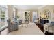 Cozy living room with patterned chairs, neutral walls, and a decorative bookshelf at 122 Ringneck Trl, Mooresville, NC 28117