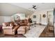 Spacious living room featuring comfortable seating, a large area rug, and access to dining, perfect for relaxation and entertaining at 122 Ringneck Trl, Mooresville, NC 28117