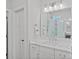 Stylish bathroom featuring white marble countertops and a glass-enclosed shower at 12615 Es Draper Dr, Huntersville, NC 28078
