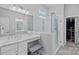 Bright bathroom with a glass shower, vanity area, and access to a spacious walk-in closet at 12615 Es Draper Dr, Huntersville, NC 28078