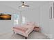 Charming bedroom with soft pink accents, a plush bed, and a cozy ambiance at 12615 Es Draper Dr, Huntersville, NC 28078