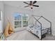 Cozy bedroom featuring a stylish bed, a teepee, and plenty of natural light at 12615 Es Draper Dr, Huntersville, NC 28078