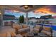 Comfortable outdoor seating area featuring a barbecue, pool, and lounge chairs, ideal for entertaining at 12615 Es Draper Dr, Huntersville, NC 28078