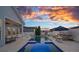 Resort-style pool area with spa, in-pool lounge chairs, fire bowls, and patio seating for relaxing evenings at 12615 Es Draper Dr, Huntersville, NC 28078
