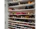 Organized shoe closet featuring multiple shelves filled with a diverse collection of footwear at 12615 Es Draper Dr, Huntersville, NC 28078