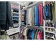 Organized walk-in closet with shelving, hanging racks, and ample storage for clothing and accessories at 12615 Es Draper Dr, Huntersville, NC 28078