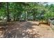 Expansive backyard surrounded by lush greenery and mature trees, providing ample space at 1282 W Hwy 27 Hwy, Lincolnton, NC 28092