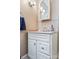 Charming bathroom featuring a white vanity with a marble countertop and a decorative mirror at 1282 W Hwy 27 Hwy, Lincolnton, NC 28092