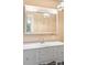 Bright bathroom vanity with white cabinets, a large mirror, and ample counter space at 1282 W Hwy 27 Hwy, Lincolnton, NC 28092