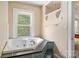 Tranquil bathroom featuring a modern bathtub with tile surround and a window view at 1282 W Hwy 27 Hwy, Lincolnton, NC 28092