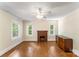 Bright bedroom with hardwood floors, a brick fireplace, and large windows at 1282 W Hwy 27 Hwy, Lincolnton, NC 28092