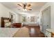 Bright bedroom with hardwood floors, a ceiling fan, two windows, and two twin beds at 1282 W Hwy 27 Hwy, Lincolnton, NC 28092