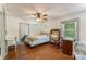 Cozy bedroom with hardwood floors, a ceiling fan, and natural light from the windows at 1282 W Hwy 27 Hwy, Lincolnton, NC 28092