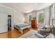 Cozy bedroom featuring hardwood floors, a large closet, and bright windows at 1282 W Hwy 27 Hwy, Lincolnton, NC 28092