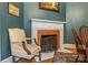 Close up on an ornate white fireplace with brick surround in the dining room at 1282 W Hwy 27 Hwy, Lincolnton, NC 28092