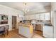 Well-lit kitchen featuring stainless steel appliances, an island, and white cabinets at 1282 W Hwy 27 Hwy, Lincolnton, NC 28092