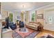 Bright living room with hardwood floors, a large area rug, and ample natural light at 1282 W Hwy 27 Hwy, Lincolnton, NC 28092