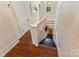 Bright hallway showcases a staircase featuring hardwood floors and white railings at 1282 W Hwy 27 Hwy, Lincolnton, NC 28092