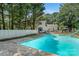Relaxing backyard featuring a large in-ground swimming pool and a white picket fence at 1282 W Hwy 27 Hwy, Lincolnton, NC 28092