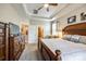 Primary bedroom featuring a tray ceiling, a large bed, and access to the bathroom and closet at 1313 Haywood Park Rd, Marvin, NC 28173