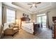 Spacious bedroom features a comfortable bed, ceiling fan, and sliding door to the outside at 1313 Haywood Park Rd, Marvin, NC 28173