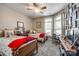 Cozy bedroom with two twin beds, a ceiling fan, and bay windows allowing natural light at 1313 Haywood Park Rd, Marvin, NC 28173