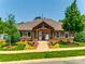 Community clubhouse with stone facade, manicured landscaping, and a welcoming entrance at 1313 Haywood Park Rd, Marvin, NC 28173