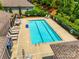 Aerial view of the community pool and patio with lounge chairs at 1313 Haywood Park Rd, Marvin, NC 28173