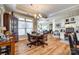 Elegant dining area with hardwood floors, modern lighting, and an open layout connects to kitchen and living room at 1313 Haywood Park Rd, Marvin, NC 28173