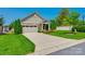 Charming home featuring stone accents, a two-car garage, well-manicured lawn, and mature landscaping at 1313 Haywood Park Rd, Marvin, NC 28173