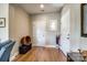 Welcoming foyer with hardwood floors, neutral paint, and natural light coming through a decorative window at 1313 Haywood Park Rd, Marvin, NC 28173