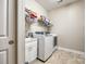 Organized laundry room with modern appliances, a utility sink, and plenty of storage shelves at 1313 Haywood Park Rd, Marvin, NC 28173