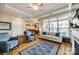 Inviting living room showcasing hardwood floors, a fireplace, large windows, and an open layout at 1313 Haywood Park Rd, Marvin, NC 28173