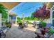 The outdoor patio is perfect for entertaining with a dining set, seating area, grill, and string lights at 1313 Haywood Park Rd, Marvin, NC 28173