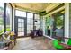 The screened porch is an extension of the living space with serene view of the backyard at 1313 Haywood Park Rd, Marvin, NC 28173