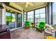 Relax in the screened porch with tiled flooring, ceiling fan, and large windows overlooking the backyard at 1313 Haywood Park Rd, Marvin, NC 28173