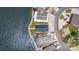 A bird's-eye view showcases waterfront homes with well-maintained landscaping along a serene lake at 141 Badin Lake Cir, New London, NC 28127