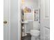 Well-lit half-bathroom features pedestal sink, white trim, and neutral wall color at 141 Badin Lake Cir, New London, NC 28127